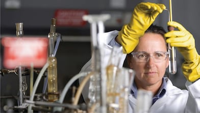Laboratory scientist performing oil condition test