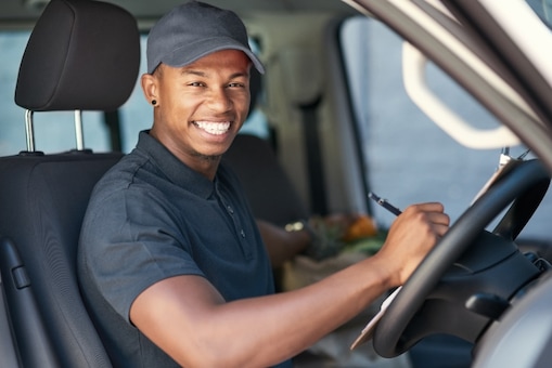 Man smiling in a car